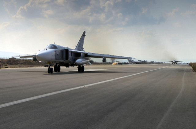 A Russian SU-24M jet fighter prepares to take off from an airbase Hmeimim in Syria on October 6, 2015. A spokeswoman for the Russian foreign ministry has rejected claims that Russia in its airstrikes in Syria is targeting civilians or opposition forces. (AP Photo/ Russian Defense Ministry Press Service)