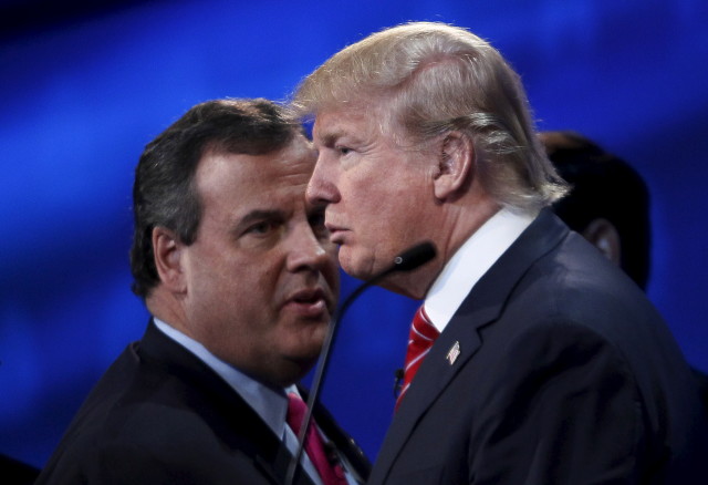 Republican presidential candidates Chris Christie (L) and Donald Trump talk during a break in the candidates debate held by CNBC in Boulder, Colorado, October 28, 2015.  REUTERS