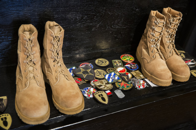 Patches left by U.S. and other ISAF member country soldiers are seen on a step after a memorial for Specialist Wyatt Martin and Sergeant First Class Ramon Morris at Bagram Air Field in the Parwan province of Afghanistan December 23, 2014. Specialist Martin and Sergeant First Class Ramon were killed on December 12th by an improvised explosive device while on patrol near Bagram Air Field. Picture taken  December 23, 2014.  (REUTERS
