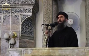Islamic State leader Abu Bakr al-Baghdadi makes his first public appearance at a mosque in the center of Iraq's second city, Mosul, according to a video posted on the Internet on July 5, 2014. (Reuters)