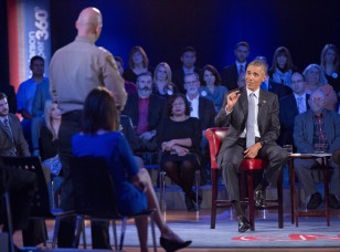 President Barack Obama, right, answers questions from Arizona Sheriff Paul Babeu, left standing, during a televised town hall meeting in Fairfax, Va. on Jan. 7, 2016.  (AP)