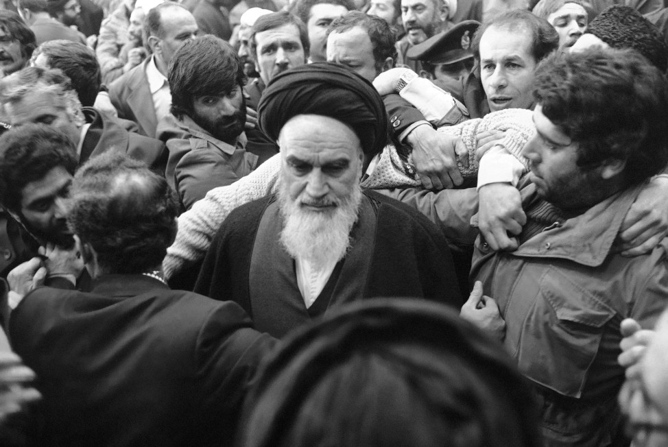 Ayatollah Khomeini is surrounded by supporters after delivering a speech at the airport in Tehran  on Feb. 1, 1979, the day of his return from 14 years of exile. (AP)