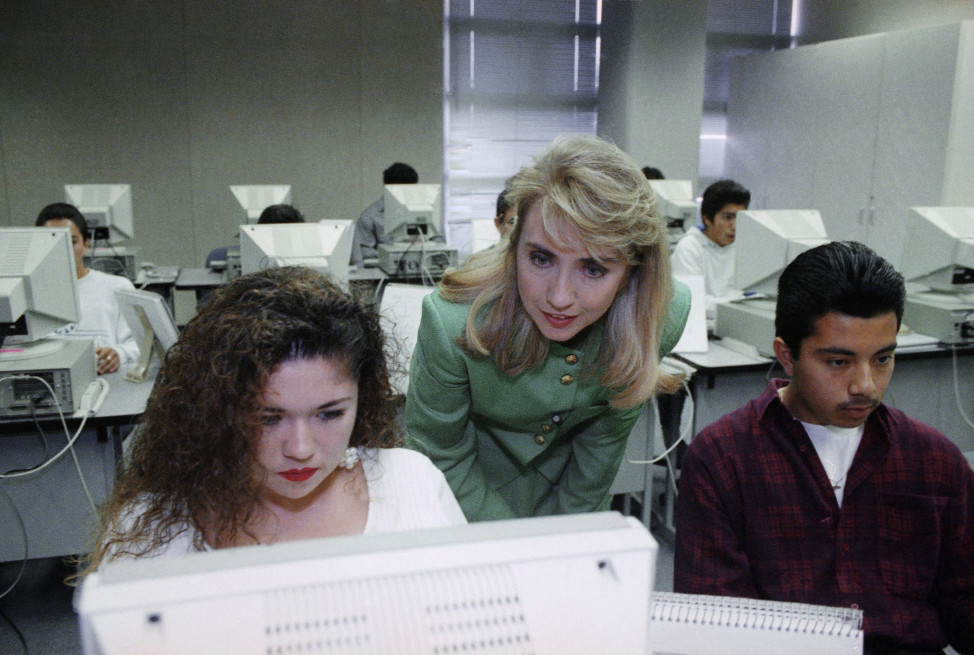 Hillary Clinton, center, visits with students at Century High School in Santa Ana, California in this May 1992 file photo (AP) 