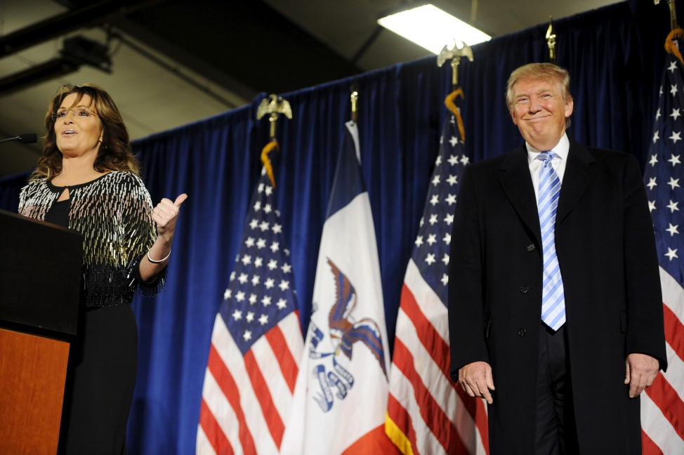 Former Alaska Gov. Sarah Palin (L) points to Republican presidential candidate Donald Trump (R) as she speaks after endorsing him for President at a rally in Ames, Iowa Jan. 19, 2016. REUTERS 