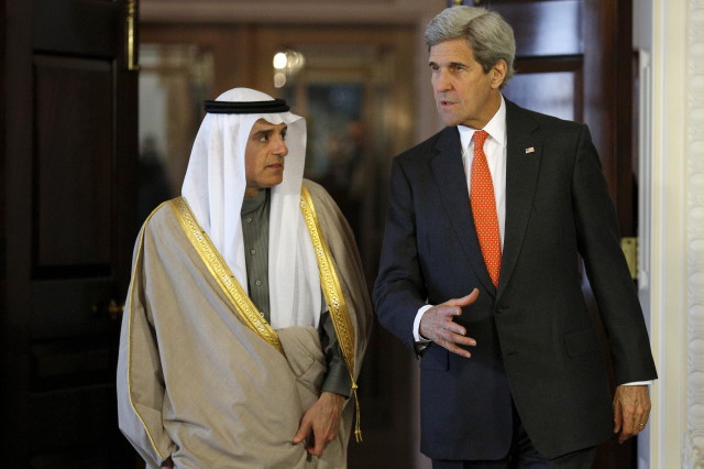 U.S. Secretary of State John Kerry (R) and Saudi Foreign Minister Adel al-Jubeir walk out of a room after a meeting at the State Department, Feb. 8, 2016.  REUTERS