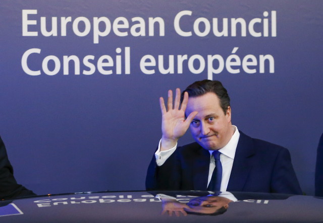 British Prime Minister David Cameron waves as he leaves a European Union leaders' summit in Brussels Feb. 20, 2016. Cameron said on Friday he would campaign with all his "heart and soul" for Britain to stay in the European Union after he won a deal about  the so-called Brexit, in Brussels which offered his country "special status".  (Reuters)