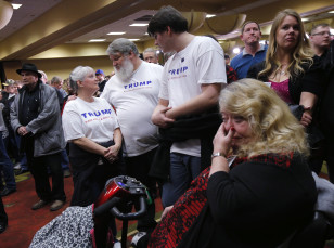 Supporters of Republican presidential candidate Donald Trump react as they gather for a post-caucus rally in Des Moines,Iowa on Feb. 1, 2016.(Reuters) 