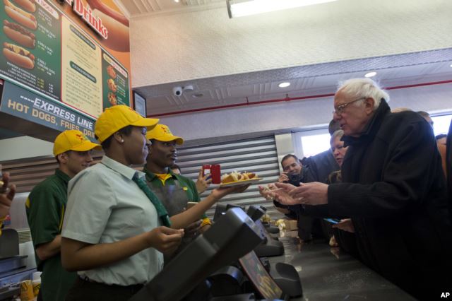 Democratic presidential candidate, Sen. Bernie Sanders, I-Vt., orders hot dogs at Nathans Famous in Coney Island in the Brooklyn, New York, Sunday, April 10, 2016.