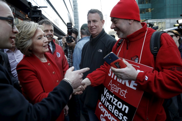 Democratic presidential candidate Hillary Clinton greets picketing Verizon workers who are out on strike in New York City April 13, 2016. (Reuters)