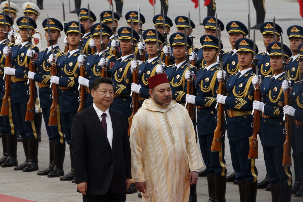 China's President Xi Jinping, left, and Moroccan King Mohammed VI walk as they inspect the Chinese honor guard during a welcoming ceremony outside the Great Hall of People in Beijing, China, May 11, 2016. (AP)