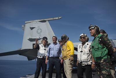 Defense Secretary Ash Carter and Philippine Defense Secretary Voltaire Gazmin tour the flight deck of the USS John C. Stennis in the South China Sea, April 15, 2016. (DoD photo)