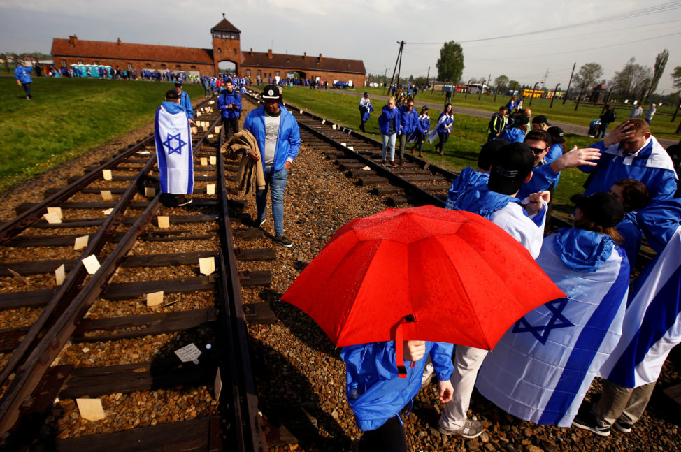 People march in the former Nazi death camp of Auschwitz-Birkenau (Auschwitz II) as thousands of people, mostly youth from all over the world gathered for the annual "March of the Living" to commemorate the Holocaust in Brzezinka near Oswiecim, Poland May 5, 2016. (Reuters) 