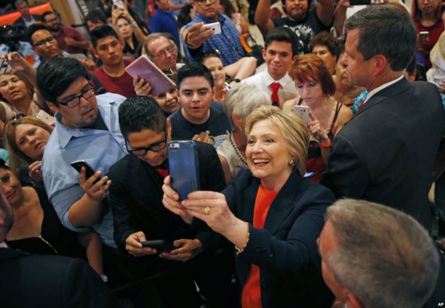 Democratic presidential candidate Hillary Clinton takes a selfie with supporters at a rally, in El Centro, Calif., June 2, 2016.
