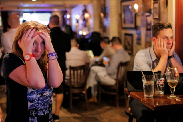 People gathered in The Churchill Tavern, a British themed bar, react as the BBC predicts Briatin will leave the European Union, in the Manhattan borough of New York, U.S., June 23, 2016.  (Reuters) 