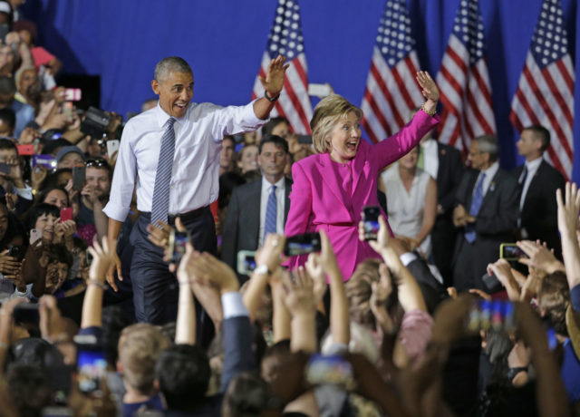 President Barack Obama and Democratic presidential candidate Hillary Clinton wave to the crowd during a campaign rally for Clinton in Charlotte, N.C., Tuesday, July 5, 2016. (AP)