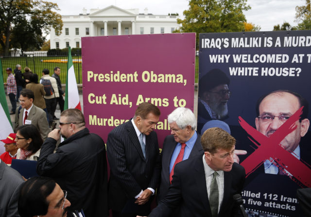 FILE - Former U.S. Secretary of Homeland Security Tom Ridge (3rd R), former House Speaker Newt Gingrich (R-GA) (2nd R), and former U.S. Representative Patrick Kennedy (D-RI) (R) rally with supporters of Iranian opposition group Mujahedin-e Khalq (MEK) as they protest against Iraq's Prime Minister Nuri al-Maliki  hours before he is scheduled to meet with U.S. President Barack Obama, at the White House in Washington, November 1, 2013. (REUTERS)  