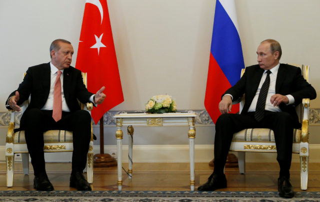 Turkish President Tayyip Erdogan speaks to Russian President Vladimir Putin (R) during their meeting in St. Petersburg, Russia, August 9, 2016. (Reuters) 