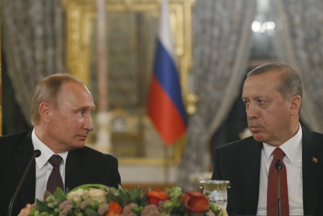Turkey's President Recep Tayyip Erdogan, right and Russian President Vladimir Putin, left, look at each other during a news conference following their meeting in Istanbul Oct. 10, 2016. Putin and Erdogan voiced support for the construction of a gas pipeline from Russia to Turkey, called Turkish Stream, a project that was suspended amid tensions between the two countries. The pipeline would carry Russian natural gas to Turkey and onto European Union countries. (AP)