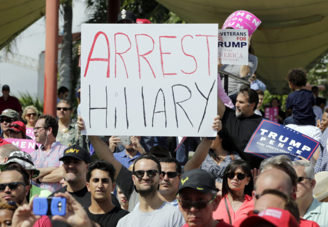 A supporter of Republican presidential candidate Donald Trump holds up a sign referring to Democratic presidential candidate Hillary Clinton during a Trump campaign rally at Bayfront Park Amphitheater, Nov. 2, 2016, in Miami. (AP)
