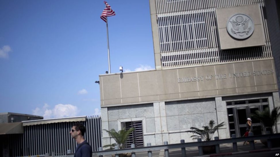 A,man walks past the U.S Embassy in Tel Aviv, Israel in this file photo from Aug. 4, 2013. President-elect Trump's choice to be the U.S. ambassador to Israel has said he intends to work out of a U.S. embassy in Jerusalem. Long-time U.S. policy is to keep the embassy in Tel Aviv until a agreement is reached between the Israelis and Palestinians over Jerusalem's status. (AP) 