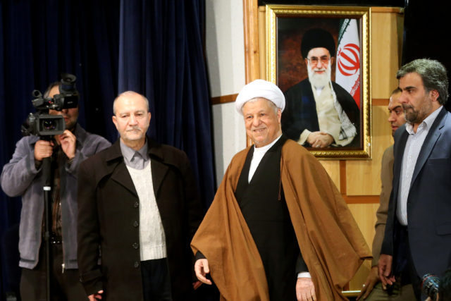 In this December 2015 photo, former Iranian President Akbar Hashemi Rafsanjani, center, who is also a member of the Experts Assembly, arrives for a press briefing after registering his candidacy for the Feb. 26 elections of the assembly at interior ministry in Tehran, Iran. Rafsanjani died of a heart attack January 8 in Tehran. He was 82. (AP