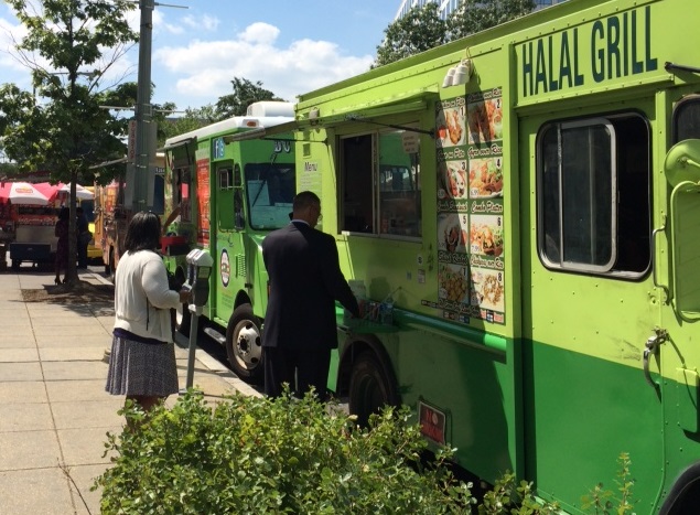 A row of mobile food trucks serve lunch near Capital Hill in Washington, D.C.  