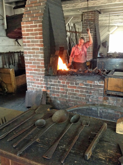 Costumed interpreters practice ancient crafts, such as blacksmithing, in much the same way they were practiced in 1700s America.