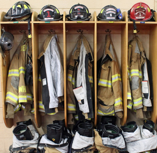 Volunteer firefighter uniforms hanging at the ready at the Enders Volunteer Fire Company in Berryville, Virginia.     