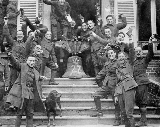 New York troops in Corbie, France, celebrate the signing of the Armistice Treaty, Nov. 11, 1918.  (AP Photo)