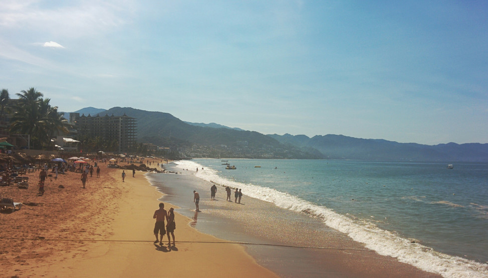 Tourists on the beach in Puerto Vallarta, Mexico, Jan. 18, 2015. (Photo by Dennis S. Hurd) 