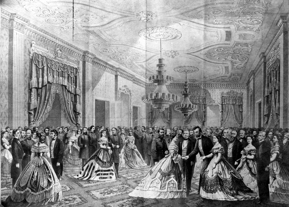 President Abraham Lincoln, right, receiving guests at his first reception in the East Room of the White House in Washington, D.C. in 1861.  (AP Photo)