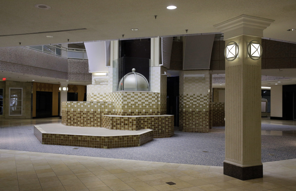 Inside the largely empty White Flint Mall in Bethesda, Maryland, Dec. 1, 2014. Mall owners plan to redevelop the space into an open-air town center. (AP Photo)