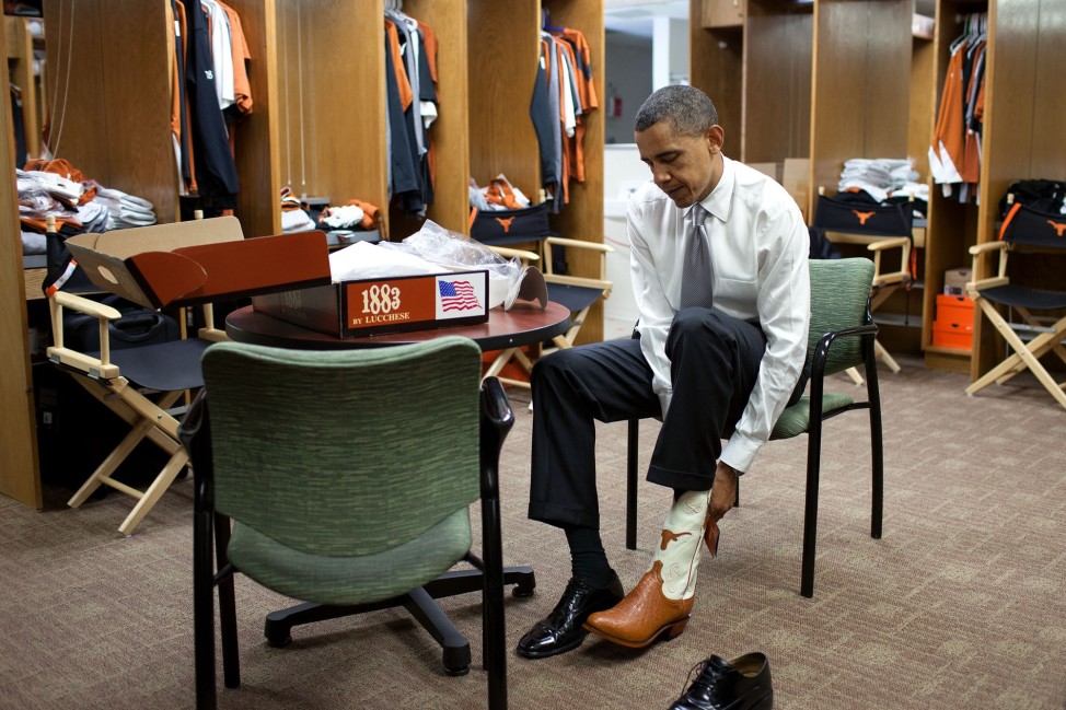 Texas, Aug. 9, 2010. Trying on a pair of cowboy boots at the University of Texas in Austin. (Official White House Photo by Pete Souza)