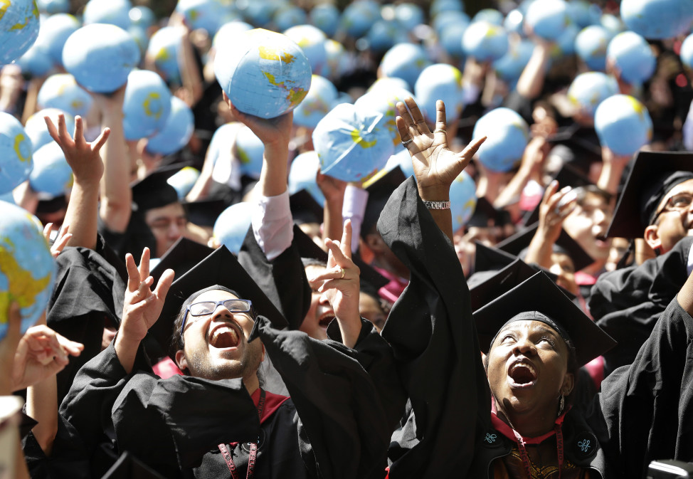 Students celebrate after graduating from Harvard University on May 28, 2015, in Cambridge, Massachusetts. (AP Photo)