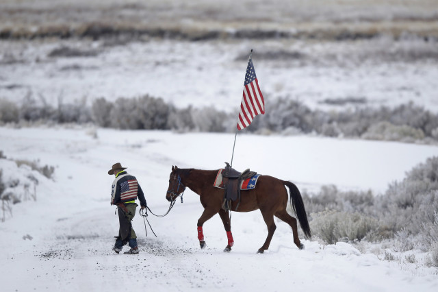 Cowboy Dwane Ehmer, of Irrigon, Oregon, a supporter of a small, armed group that occupied a remote refuge in Oregon to protest federal land policies, walks his horse near Burns, Oregon, on Jan. 7, 2016. (AP Photo)