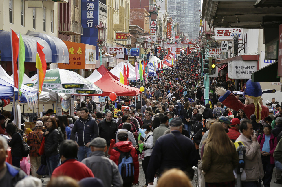 Crowds jam Grant Avenue in Chinatown during a Chinese New Year festival and fair Saturday, Feb. 20, 2016, in San Francisco. (AP Photo)