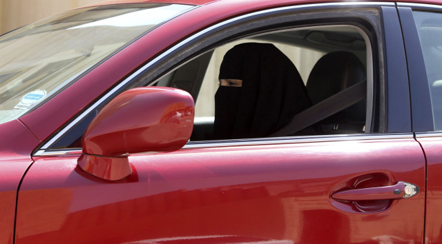 A woman drives a car in Saudi Arabia