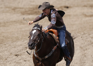 Melby of Burneyville, Oklahoma rides her horse in the barrel racing event during the 101st Calgary Stampede rodeo in Calgary