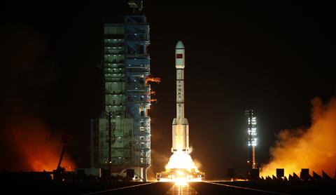 A rocket loaded with China's unmanned space module Tiangong-1 lifts off from the launch pad in the Jiuquan Satellite Launch Center