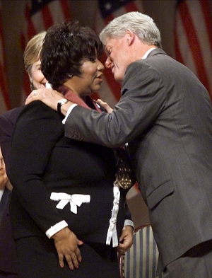 President Clinton prepares to kiss singer Aretha Franklin after awarding her with a National Medal of Arts during a ceremony in Washington, Sept. 29, 1999 