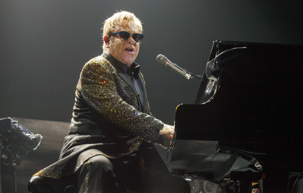 Sir Elton John performs at the Allstate Arena on Saturday, Nov 30, 2013, in Rosemont, IL. (Photo by Barry Brecheisen/Invision for Invision/AP)