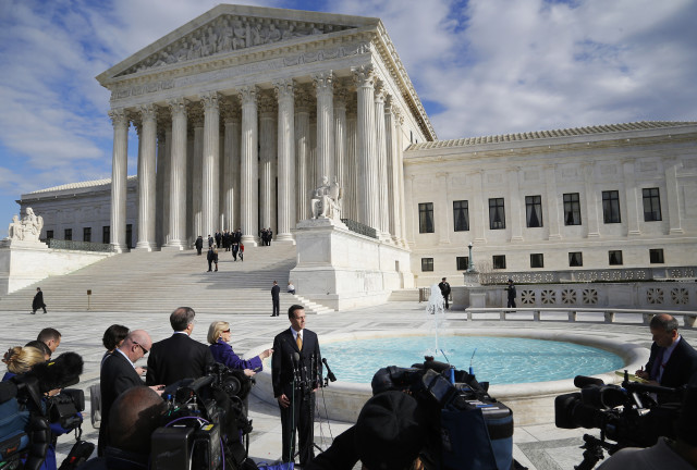 National Crime Victim Bar Association Director Jeff Dion speaks with reporters about victims' rights after arguments in the case of Anthony Elonis, who was convicted in 2010 on the grounds of threatening his wife via social media, at the Supreme Court building in Washington December 1, 2014. The U.S. Supreme Court appeared conflicted on Monday over whether to uphold the conviction of a Pennsylvania man found guilty of making threatening statements to his estranged wife, law enforcement officers and others on social media.   REUTERS/Jonathan Ernst