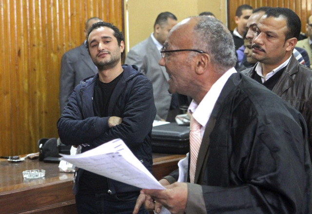 Egyptian political activist Ahmed Douma attends his trial in Cairo