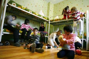 Orphan children play in their bedroom at an orphanage in the southern Russian city of Rostov-on-Don
