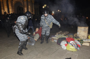 Video clips went viral of riot police clubbing, gassing and kicking demonstrators under the cover of darkness. Photo: AP/Sergei Chuzavkov