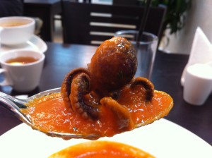 At journalist hotel, food is tasty, like this spoonful of seafood dinner. VOA Photo James Brooke