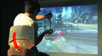 Surround Haptics, developed at Disney Research, Pittsburgh, enhances video game play by using an array of vibrating actuators in a chair to create the tactile illusion of continuous strokes on the player’s back. (Photo: Disney Research, Pittsburgh)