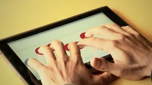 Touchscreen Braille writer created by undergraduate student Adam Duran with his mentors Adrian Lew, an assistant professor of mechanical engineering, and doctoral candidate Sohan Dharmaraja from Stanford University. (Photo: Stanford School of Engineering)