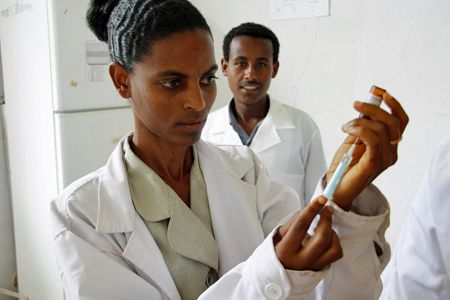 A nurse at Merawi health center in northern Ethiopia prepares a measles vaccine for delivery. (Photo: Pete Lewis/Department for International Development)