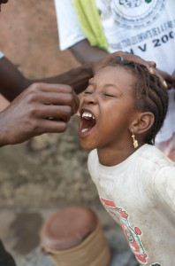 Young girl in Conakry, Guinea getting her polio vaccine. (Photo: Julien Harneis on Flickr)